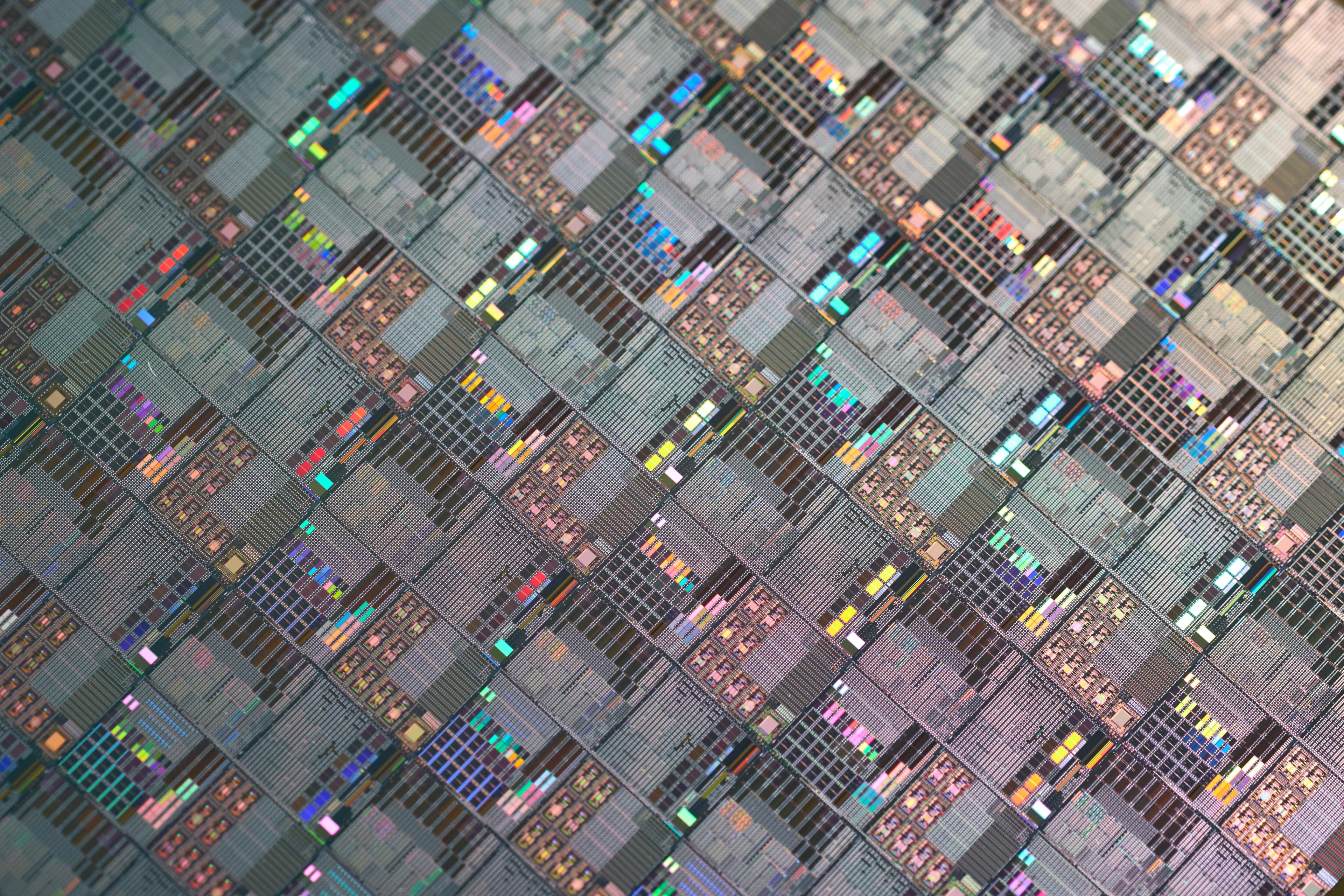 image shows macro of silicon semiconductor wafer.
